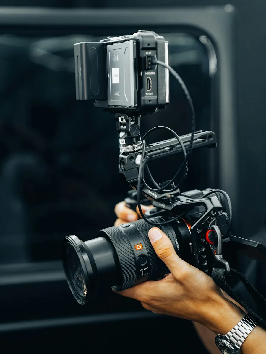 Person holding a camera in front of a mirror