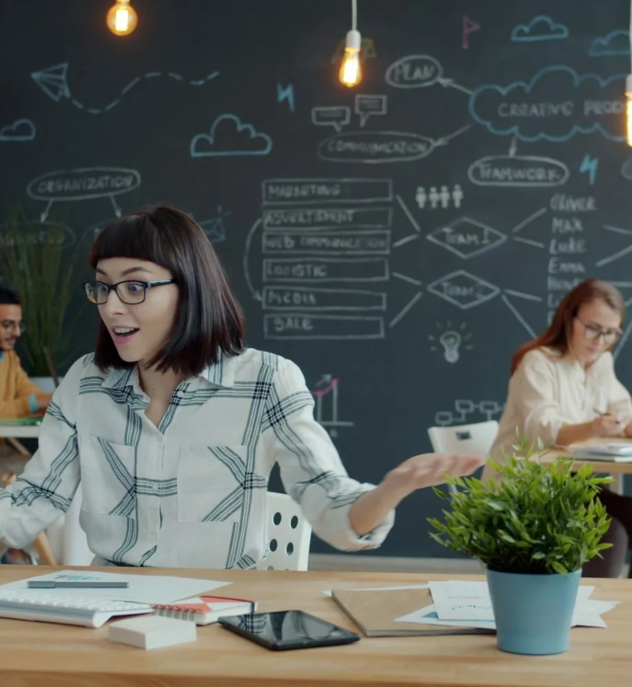 People working in a modern office with chalk drawings